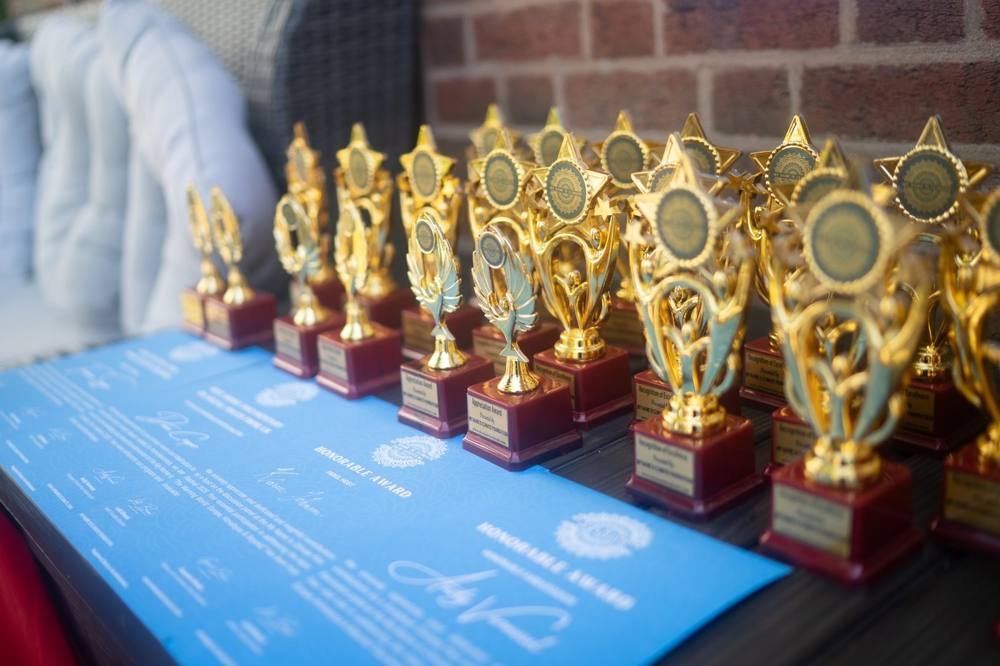 Festival trophies lined up on a table